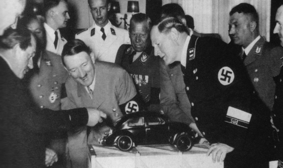 Ferdinand Porsche shows Adolf Hitler the VW Beetle