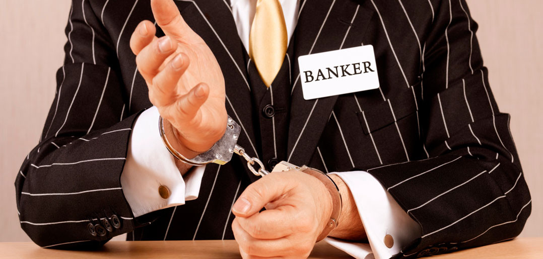 banker-handcuffed