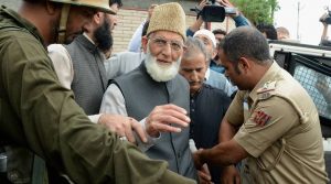 Srinagar: Police arrest Separatist leader and Chairman of Hurriyat Conference Syed Ali Shah Geelani after he defy his house arrest and took out a protest march towards Army Headquaters in Badami Bagh to protest against the killing of civilians in Srinagar on Saturday. PTI Photo (PTI8_27_2016_000146B)